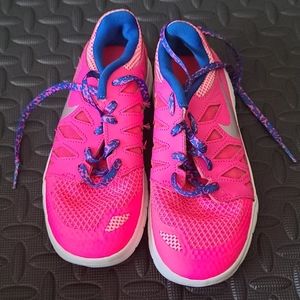 Never worn girls Nike shoes.